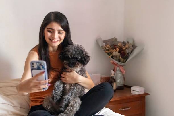 istock Cute woman taking a selfie with her doggy 2181073744