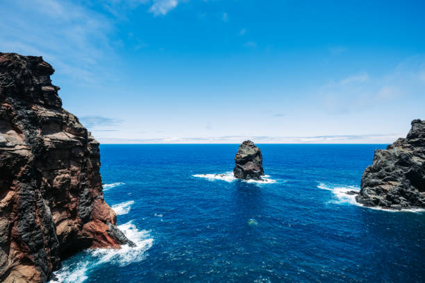 View from sea towards the highest headland on the island