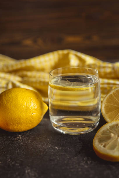 istock Cool freshly made lemonade in glass on wooden table. Space for text 2181079896
