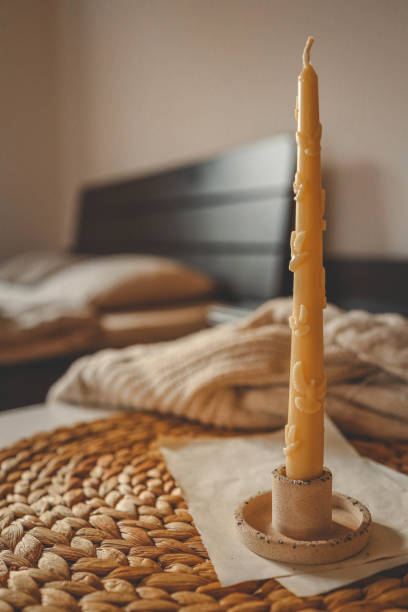 istock Organic Beeswax Candle in a Homey Atmosphere 2181080012