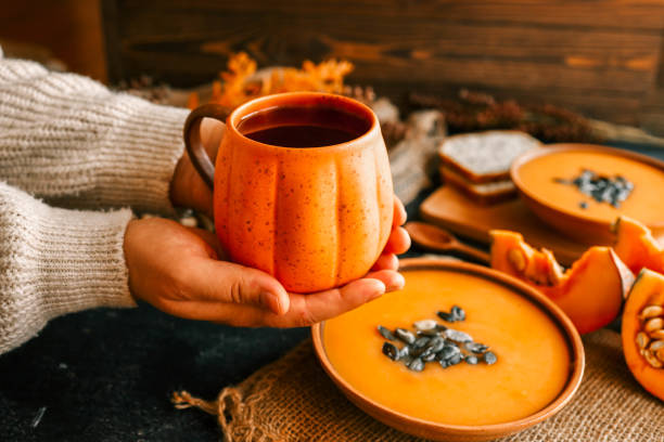 istock Cup of tea in hands, autumn mood 2181080039