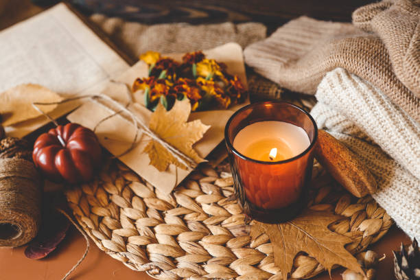 istock Burning candle in a cozy warm homey autumn atmosphere 2181080528