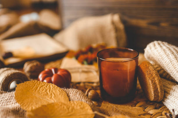 istock Burning candle in a cozy warm homey autumn atmosphere 2181080534