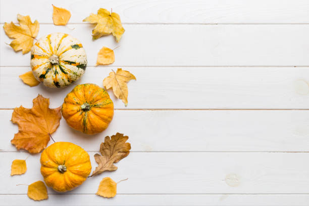 istock Autumn composition. Pattern made of dried leaves and other design accessories on table. Flat lay, top view 2181080655