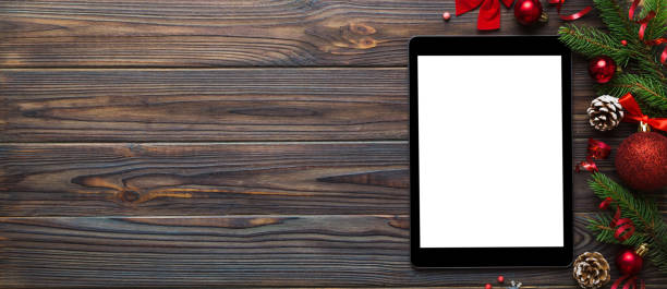 istock Digital tablet mock up with rustic Christmas decorations for app presentation top view with empty space for you design. Christmas online shopping concept. Tablet with copy space on colored background 2181080678