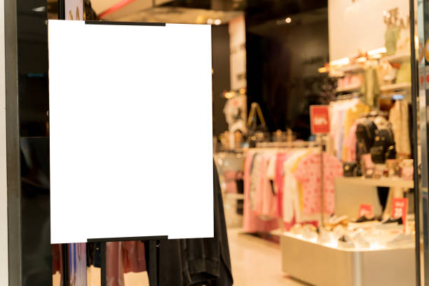 istock Blank poster frame with clothing store background. Mockup blank billboard on the wall of casual clothes shop. 2181082555