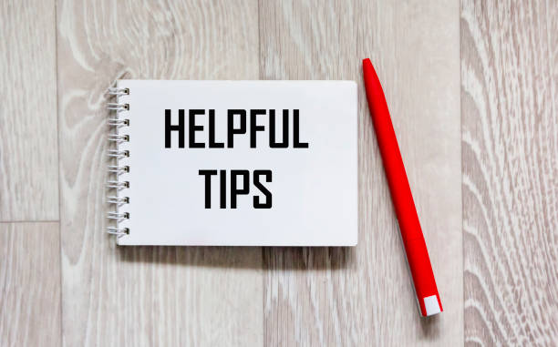 istock Useful tips words in a notebook on a gray background , next to a red pen 2181082632