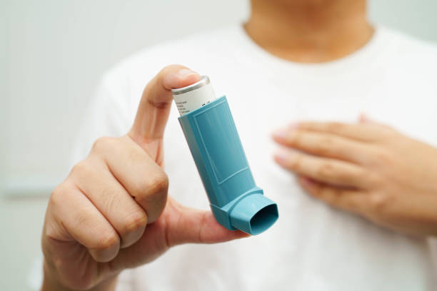 istock Asthma and chronic obstructive pulmonary disease COPD, Asian young man using metered dose inhaler MDI. 2181089228