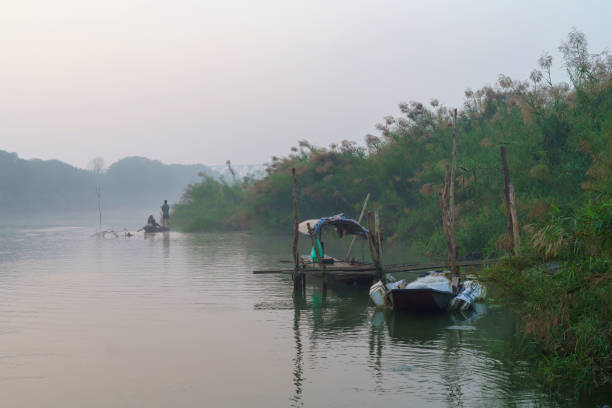istock Boats on Red river in Hanoi on misty day. 2181091185
