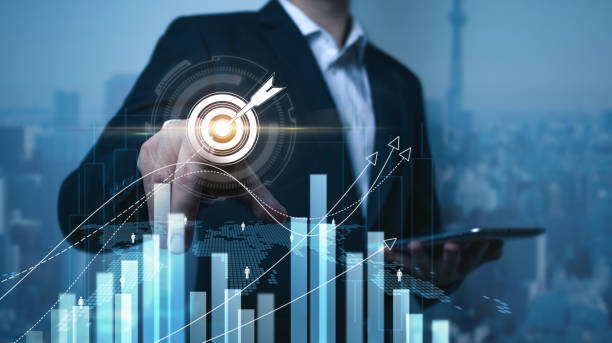 istock Businessman hand hold smartphone analyzing sustainability company growth target with digital virtual graphics, financial data for long term investment. 2181106617