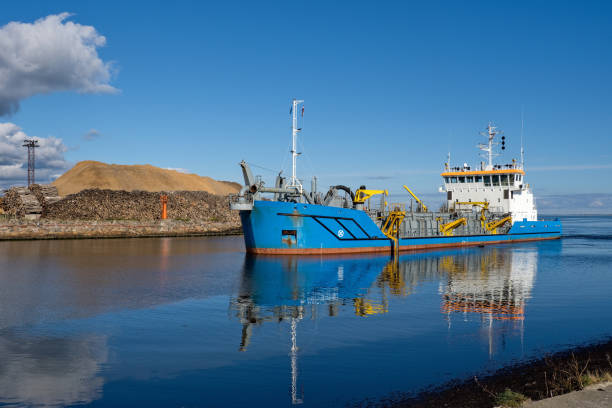 istock Dredger at work. A specialized vessel working on the fairway in the port. 2181109055