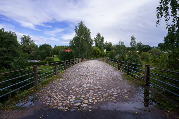 Cobblestone pathway of the historic Tonno Bridge in Orimattila, Finland