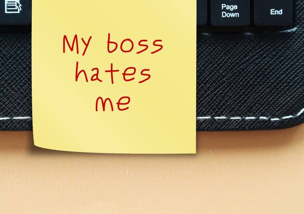 istock Note stick on keyboard with text written My boss hates me - feeling you are disliked by supervisor or having toxic relationship with manager - effects job satisfaction and productivity 2181114200