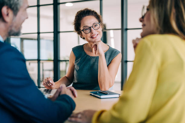 istock Group of business persons talking in the office. 2181115631