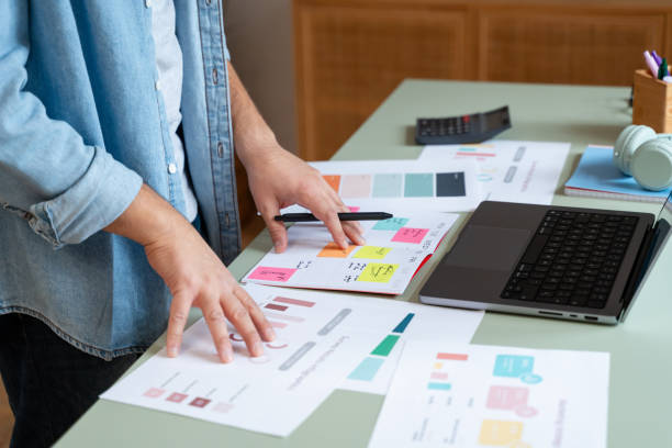 istock Marketing manager analyzing charts and business results on desk 2181117634