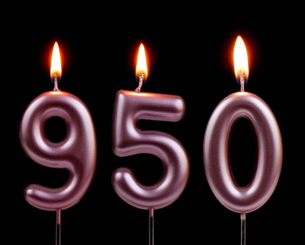 istock Pink birthday candles isolated on black background, number 950 2181122784