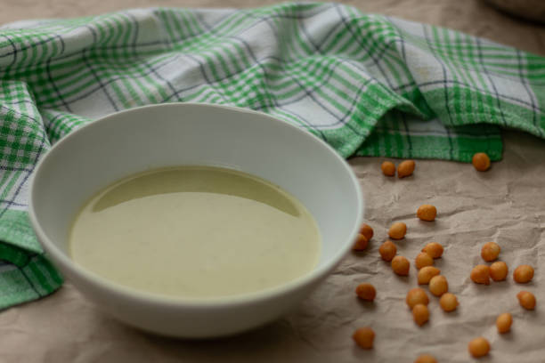 Cream of broccoli soup in white bowl. A beautifully served broccoli cream soup with soup garnish.