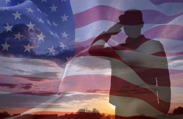 istock Silhouette of a soldier with USA flag 2181129155