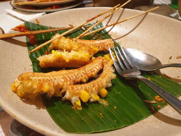 istock The corn cobs that remain after the corn has been cooked are placed on a white plate on the restaurant table 2181136242