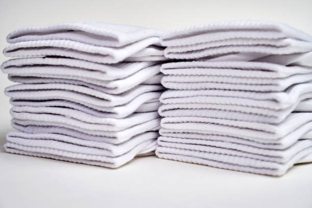 istock Stack of white socks on a white background with copy space, close-up. New cotton socks advertisement 2181140471