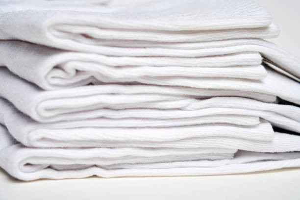 istock Stack of white socks on a white background with copy space, close-up. New cotton socks advertisement 2181140476