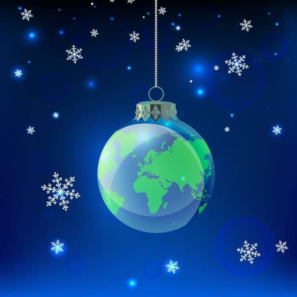 istock Sustainability concept with a globe christmas ornament hanging in a night snowy sky 2181141042