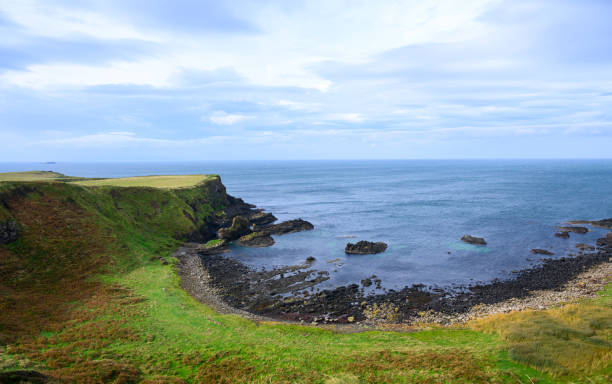 The Antrim Coastline in Northern Ireland is one of the most scenic and dramatic coastal areas in Europe, famous for its rugged cliffs, picturesque villages, and natural wonders.