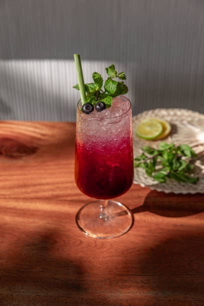 istock Blueberry drink cocktail Mocktail cooler Lemonade glass served with crushed ice, mint and lime in sunny restaurant cafe 2181145252