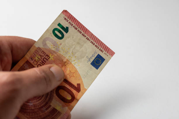 Ten euro banknote holding a hand