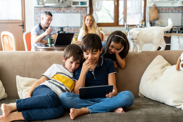 istock Two boys giggling over a movie 2181146116