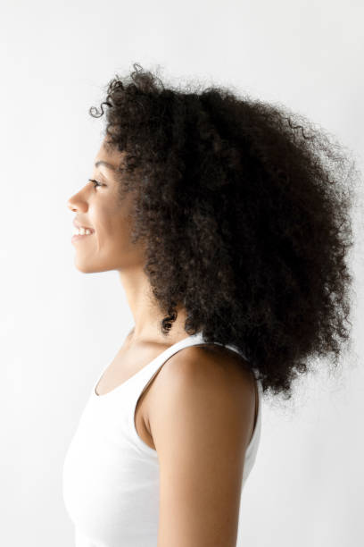 istock Woman with afro hair side profile 2181146298