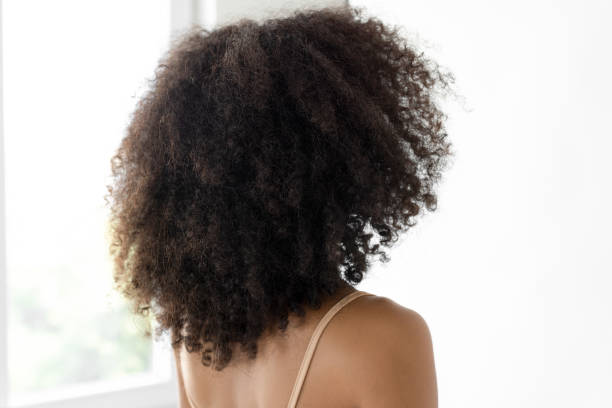 istock Back of an afro haired woman 2181146407