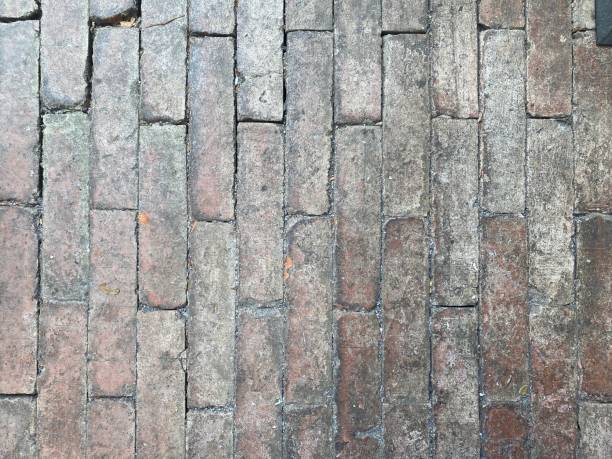 istock vertical arrangement of aged dirty bricks stone floor 2181147649