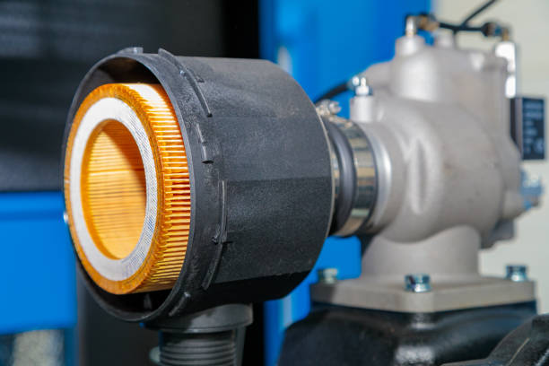 Close-up of an industrial air filter connected to machinery, highlighting its role in maintaining clean airflow and preventing contamination