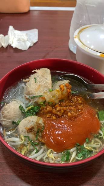 istock Bakso Malang, traditional food from Malang, East Java, Indonesia. Meatballs soup served with noodles, tofu and fried dumpling (pangsit) 2181152320