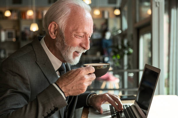istock Businessman Working with Laptop and Coffee in Cafe 2181153329