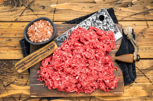 istock Chopped ground beef and pork raw meat, mince on a cutting board, top view. 2181154607