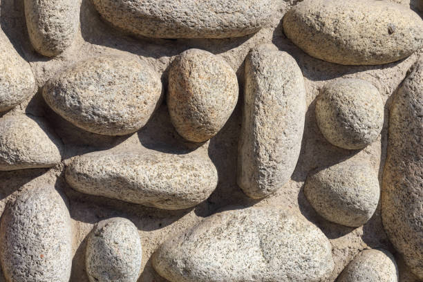 istock .a wall of round stones of various sizes 2181157261