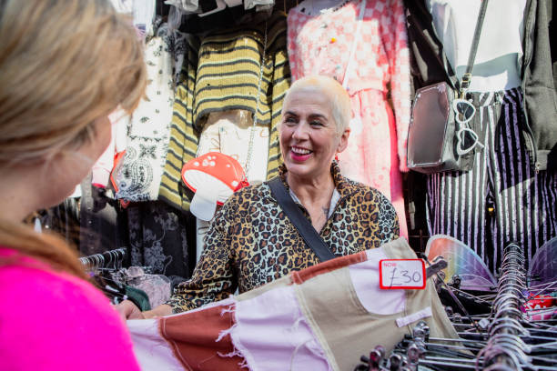 istock Woman choosing clothes on a market stall 2181161004