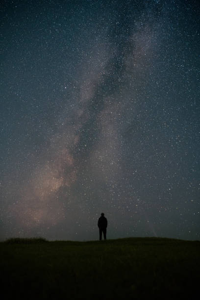 istock Milky Way contemplated by an explorer 2181170643
