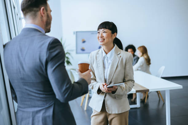 istock Businesswoman smiling during office discussion 2181181103