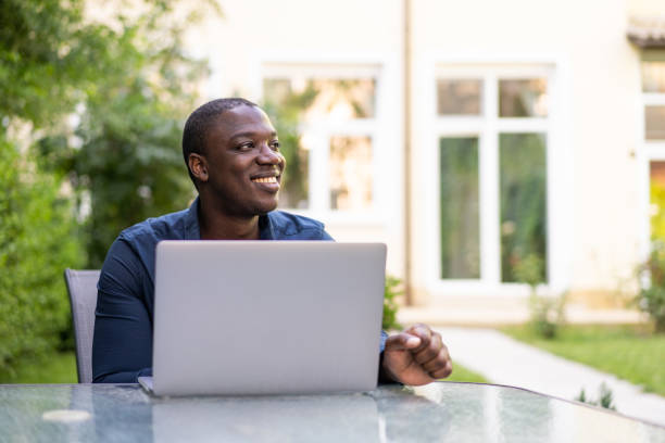 istock Businessman working on his laptop while sitting in a garden 2181182273