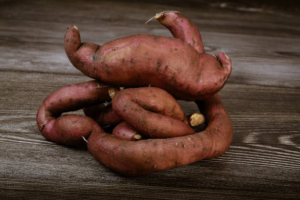 istock Sweet potatoes on the brown background 2181182778