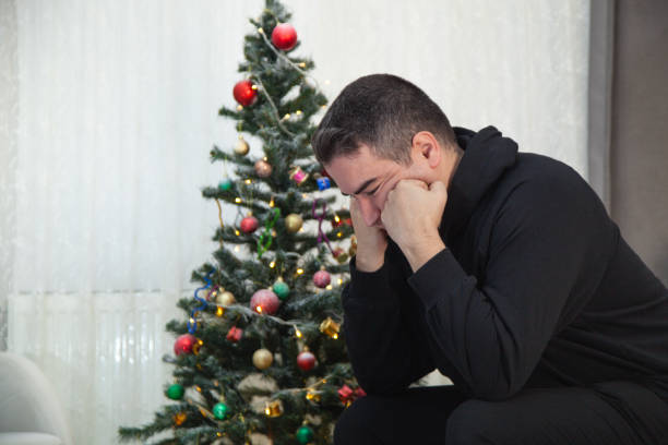 istock Alone man sitting  the seat on Christmas day at home. 2181183006