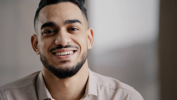 istock Dreaming arabic handsome young man agent worker deep in thoughts look away turn head at camera happy male human face friendly businessman millennial 20s guy smiling with toothy smile close up portrait 2181183355