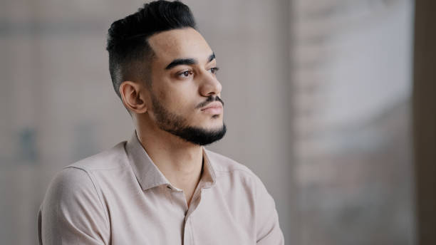 istock Dreaming unhappy arab man deep in thoughts concentrated looking away thinking difficult decision search for inspiration hispanic male serious pondering businessman guy meditate planing use imagination 2181183632