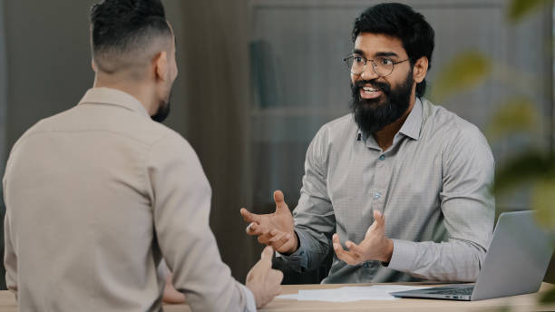 istock Two multiracial arabic hispanic colleagues businesspeople men discuss startup accept common project satisfied with result of negotiation give high five agreement partnership teamwork at office meeting 2181184838