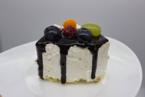 istock Slice of Fruit-Topped Layer Cake. 2181185892