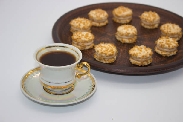istock Cup of coffee with mini nut cookies 2181185940
