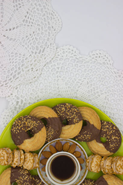 istock Chocolate-Dipped Cookies with Coffee on Lace 2181186294
